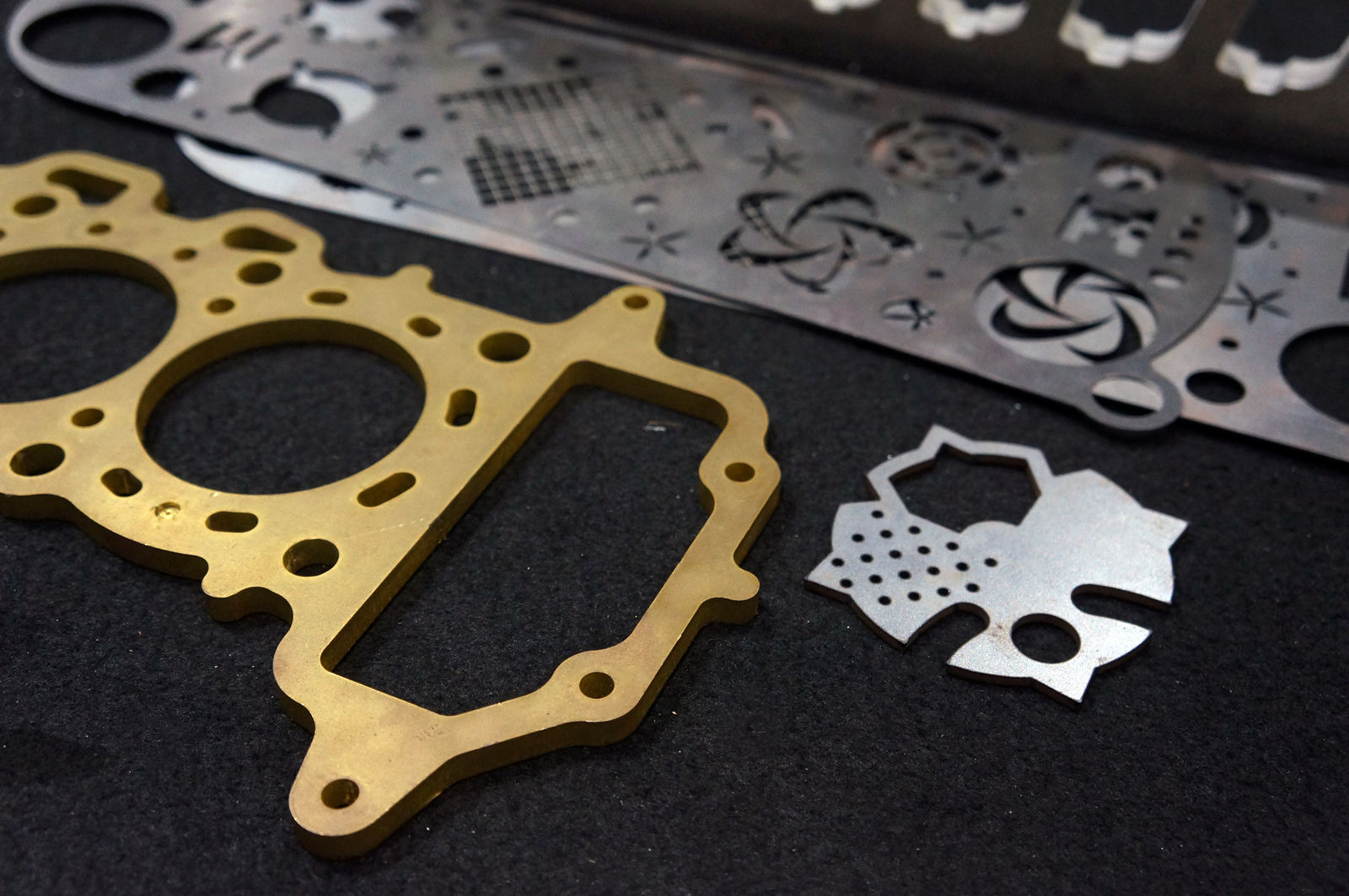 Laser cut brass gasket and decorative steel parts