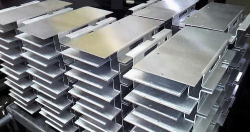 Stacks of formed aluminum brackets
