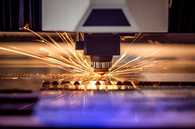 Fiber laser cutting steel with sparks