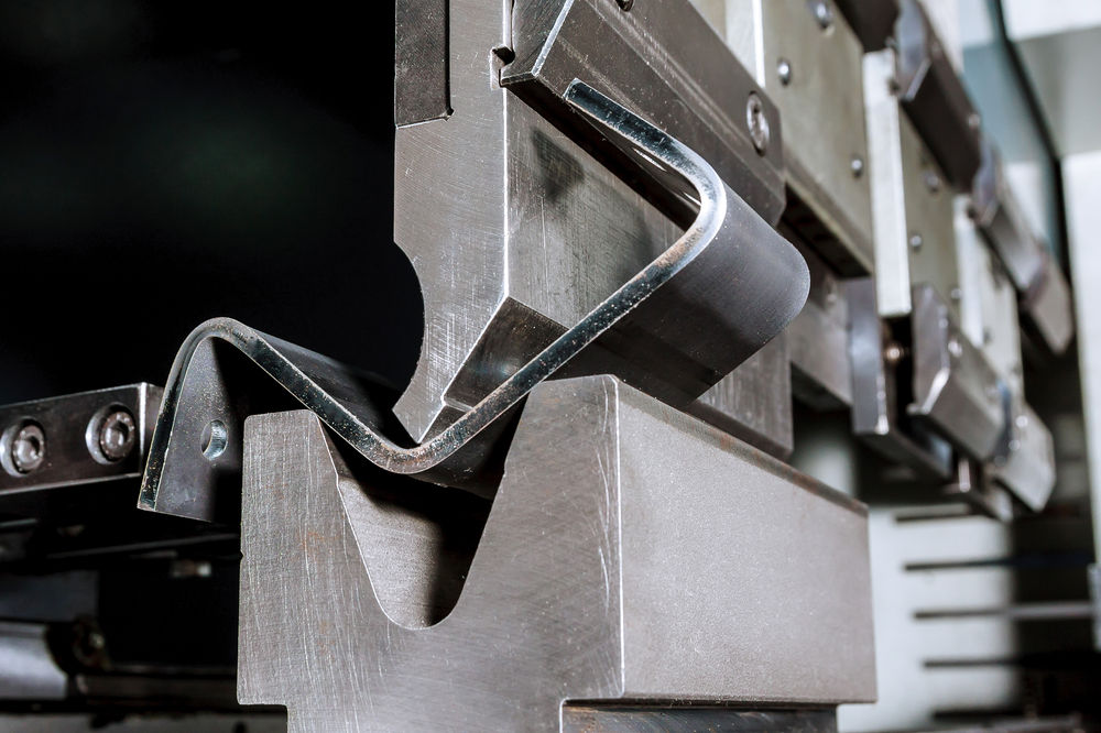 CNC press brake forming a metal part