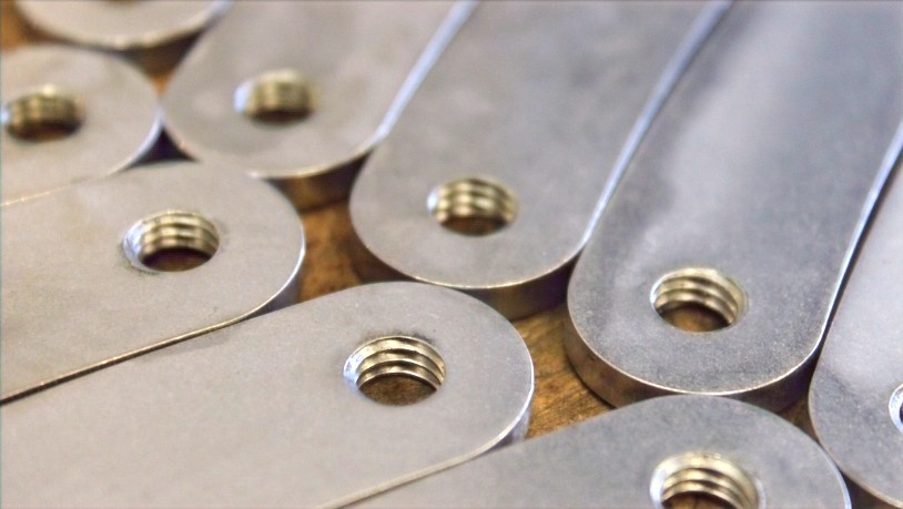 Tapped holes and threaded parts